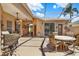 Covered patio area with clear sky and multiple seating arrangements for entertaining at 4244 Windchime Ln, Lakeland, FL 33811