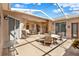 Covered patio with seating arrangements for outdoor gatherings at 4244 Windchime Ln, Lakeland, FL 33811