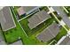 An aerial view of a property showcasing its well-maintained lawn and fenced-in backyard in a quiet neighborhood setting at 4424 Seven Canyons Dr, Kissimmee, FL 34746