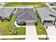 Aerial view of property showcasing the home and well-maintained lawn at 4505 Hummingbird Ln, Haines City, FL 33844
