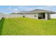 Large backyard with a privacy fence and lush green grass at 4505 Hummingbird Ln, Haines City, FL 33844