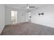 Large bedroom with carpet, a ceiling fan, and an attached bathroom with a soaking tub at 4505 Hummingbird Ln, Haines City, FL 33844