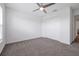 Bedroom features neutral carpet, fan, and closet for ample storage at 4505 Hummingbird Ln, Haines City, FL 33844