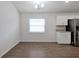 Bright dining area features hardwood floors, white cabinets, and natural light from the window at 4505 Hummingbird Ln, Haines City, FL 33844