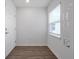 Bright entryway with hard wood floors, a window, and white trim at 4505 Hummingbird Ln, Haines City, FL 33844