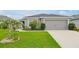 Beautiful single Gathering home featuring a well maintained lawn and a two car garage at 4505 Hummingbird Ln, Haines City, FL 33844