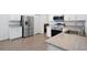Well-appointed kitchen with stainless steel appliances, white cabinets, and stone countertops at 4505 Hummingbird Ln, Haines City, FL 33844