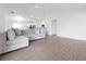 Spacious living room with hard wood floors, open floorplan, and recessed lighting at 4505 Hummingbird Ln, Haines City, FL 33844