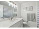 Modern bathroom featuring a white vanity, new sink and mirror with decorative lighting at 4570 Tower Pine Rd # Ge, Orlando, FL 32839