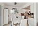 Bright dining room featuring a modern white table, mirror, and contemporary decor, perfect for gathering at 4570 Tower Pine Rd # Ge, Orlando, FL 32839