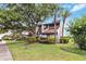 Charming townhouse with mature trees, lush landscaping, and a beautiful green lawn at 4570 Tower Pine Rd # Ge, Orlando, FL 32839