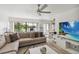 Spacious living room with a comfortable sofa, modern TV, and scenic view at 4570 Tower Pine Rd # Ge, Orlando, FL 32839