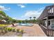 Community pool with lounge chairs and a clubhouse provides a great recreational space at 4570 Tower Pine Rd # Ge, Orlando, FL 32839