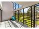 Screened-in porch with a lake view, perfect for enjoying the outdoors comfortably at 4570 Tower Pine Rd # Ge, Orlando, FL 32839