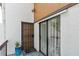 Inviting porch area featuring a secure door, sliding glass door, and welcome mat at 4570 Tower Pine Rd # Ge, Orlando, FL 32839