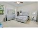 Bedroom featuring neutral colors and a sleek, modern furniture set and a ceiling fan at 4918 Wildwood Pointe Rd, Winter Garden, FL 34787