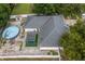 Aerial view of the house, showing backyard pergola and the covered pool at 512 Yellow Tail Pl, Chuluota, FL 32766