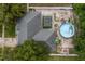 Aerial view showcasing the home's roof, the in-ground pool, and backyard at 512 Yellow Tail Pl, Chuluota, FL 32766