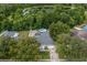 Aerial view of a home with a fenced in yard, a pool, and backing onto a pond at 512 Yellow Tail Pl, Chuluota, FL 32766