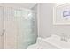 Updated bathroom with stand up shower featuring decorative tile and glass door at 512 Yellow Tail Pl, Chuluota, FL 32766