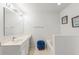 Bright bathroom featuring a vanity with sink, bathtub, and neutral tiling for a clean, fresh look at 512 Yellow Tail Pl, Chuluota, FL 32766