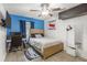 This bedroom includes a bed, desk, and decor, enhanced by a large window, creating a comfortable and inviting space at 512 Yellow Tail Pl, Chuluota, FL 32766