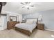 Comfortable bedroom with wood furnishings, soft lighting, and a calming color scheme perfect for relaxation at 512 Yellow Tail Pl, Chuluota, FL 32766