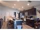 Kitchen featuring dark cabinets, an island with bar seating, and stainless steel appliances at 546 Lorient Dr, Eagle Lake, FL 33839