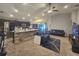 Open-concept living room and kitchen featuring carpeted floors, neutral walls, and recessed lighting at 546 Lorient Dr, Eagle Lake, FL 33839