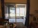 View from dining area to a screened in patio, featuring large sliding glass doors at 546 Lorient Dr, Eagle Lake, FL 33839