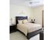 Well-lit bedroom features neutral tones, tiled flooring, ceiling fan and coordinated decor, perfect for relaxation at 5661 Parkview Lake Dr, Orlando, FL 32821