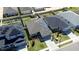 An aerial view shows the property with solar panels and landscaping at 568 Meadow Bend Dr, Davenport, FL 33837