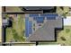 Aerial view of a home showcasing the roof, solar panels, and yard at 568 Meadow Bend Dr, Davenport, FL 33837