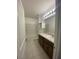 This bathroom features a shower/tub combo, sink with vanity, and tile flooring at 568 Meadow Bend Dr, Davenport, FL 33837