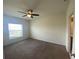 This bedroom features neutral walls, carpet flooring, and a ceiling fan at 568 Meadow Bend Dr, Davenport, FL 33837