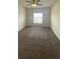 This bedroom features neutral walls, carpet flooring, and a ceiling fan at 568 Meadow Bend Dr, Davenport, FL 33837