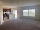 Modern kitchen with a center island, stainless appliances, and access to the yard at 568 Meadow Bend Dr, Davenport, FL 33837