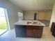 Spacious kitchen island with a stainless steel sink and room for storage at 568 Meadow Bend Dr, Davenport, FL 33837