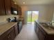Kitchen featuring a stainless steel sink, plenty of counter space, and natural light at 568 Meadow Bend Dr, Davenport, FL 33837