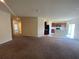 Spacious, open-plan living area connecting to the kitchen, with neutral tones at 568 Meadow Bend Dr, Davenport, FL 33837