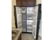 Stainless steel side-by-side refrigerator at 568 Meadow Bend Dr, Davenport, FL 33837