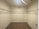 Walk-in closet featuring an inspirational quote and wire shelving at 568 Meadow Bend Dr, Davenport, FL 33837
