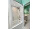 Modern bathroom featuring marble tile, shower head, and bathtub at 760 Bearcreek Dr, Bartow, FL 33830