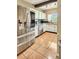 Bright kitchen with stainless steel appliances, white cabinets, tile flooring, and a large refrigerator with water dispenser at 760 Bearcreek Dr, Bartow, FL 33830