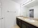 Bathroom with double sinks, granite counters, and tile floors at 771 Cavan Dr, Apopka, FL 32703