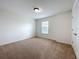 Bedroom with neutral carpet, window and white walls at 771 Cavan Dr, Apopka, FL 32703