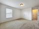 Bedroom with carpeted floor, double closet, window, and ceiling light at 771 Cavan Dr, Apopka, FL 32703