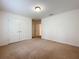Bedroom with neutral carpet, white walls, and double closet at 771 Cavan Dr, Apopka, FL 32703