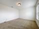 Neutral bedroom with a window, carpeted floor, and a ceiling light at 771 Cavan Dr, Apopka, FL 32703
