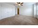 Bedroom with neutral carpet, white walls, and ceiling fan at 771 Cavan Dr, Apopka, FL 32703